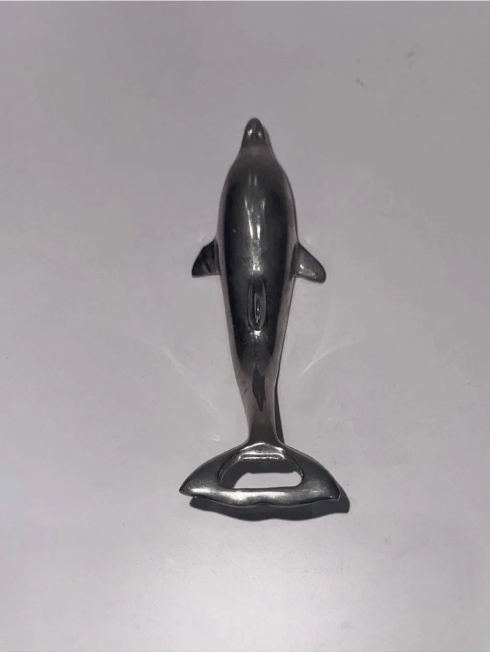 Sleek silver-plated Dolphin bottle opener